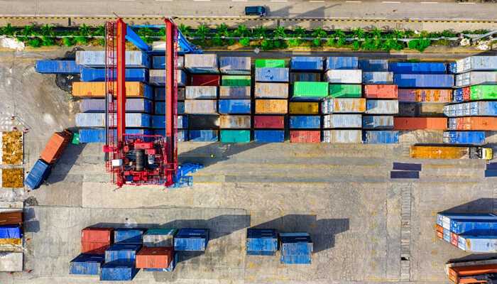 Key trends in 3pl and supply chain innovation - tycoonstory | tycoonstory media Aerial view of a busy container port, showcasing numerous shipping containers and cranes, highlighting third-party logistics operations.