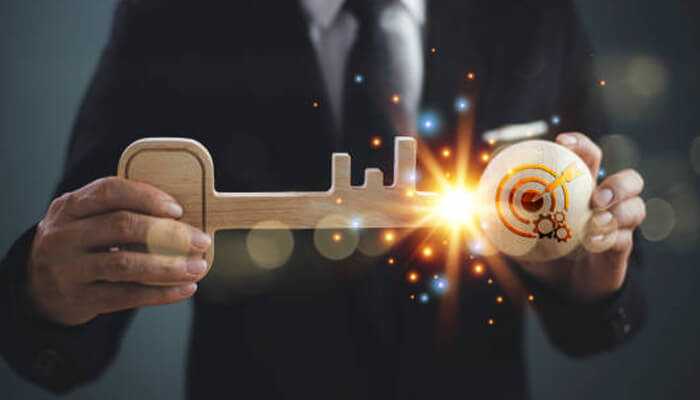 Security as a key factor for business success - tycoonstory | tycoonstory media Boost your company's Growth with the Right Strategy – A businessman holding a symbolic wooden key with a glowing target, representing success and business growth.