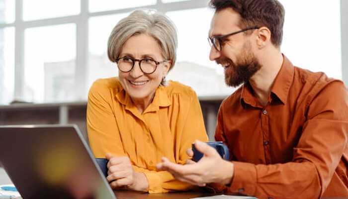 5 | tycoonstory media Retired ceo engaging in mentorship with a younger professional, showcasing intergenerational collaboration and the spirit of retirement as reinvention.