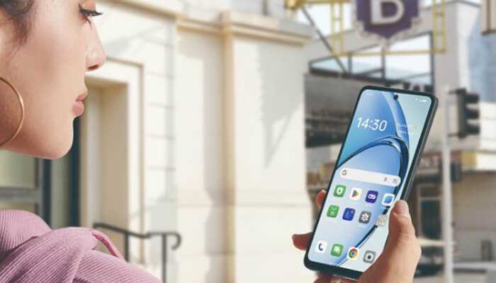 Best uses of oppo a3 during family time | tycoonstory media Oppo a3 smartphone held by a user outdoors, showcasing its sleek design and vibrant display, perfect for family entertainment and productivity.