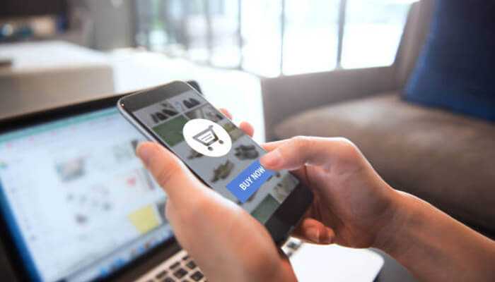 Buy online_ tycoonstory | tycoonstory media Person shopping on a smartphone — featured in an upliquidation review of online wholesale deals.