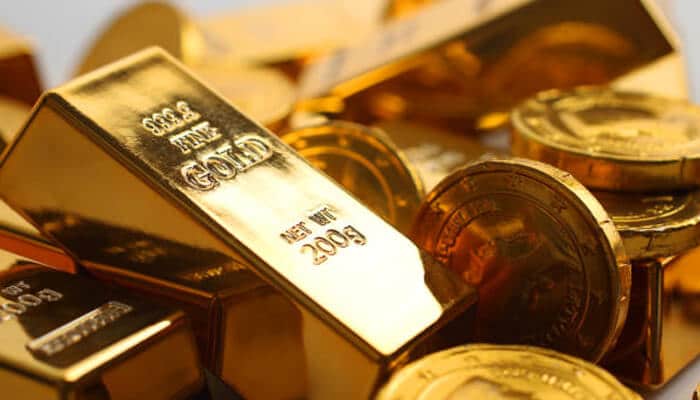 Choose the right type of gold ira | tycoonstory media Gold bars and coins highlighting the importance of gold iras for securing retirement savings.