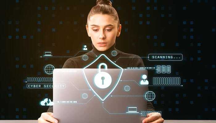 Choosing a specialization - tycoonstory | tycoonstory media Woman working on cybersecurity protocols—visualizing data protection in a growing career in cybersecurity.