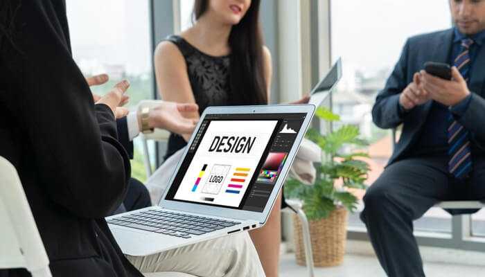 Cre | tycoonstory media Creative team working on a website design using templates to build an online brand.