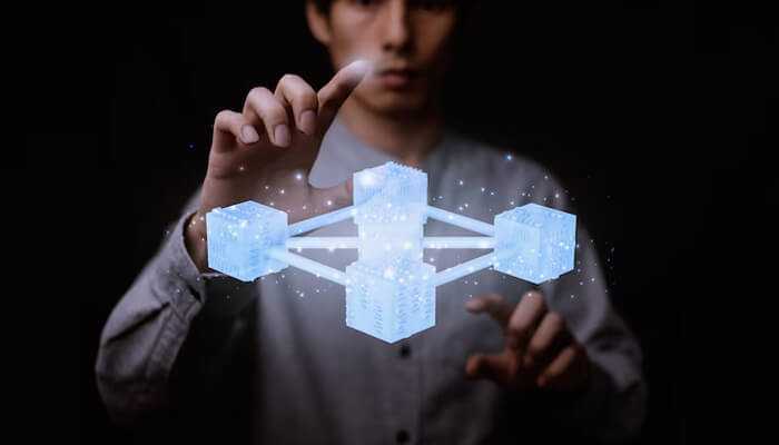 Data structures and storage solutions | tycoonstory media Person interacting with a 3d representation of blockchain architecture, showcasing interconnected digital blocks symbolizing decentralized data storage and blockchain networks.