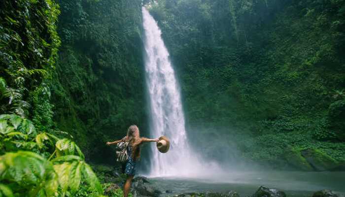 Faarumai Waterfall in French Polynesia, offering a stunning natural experience for adventurous travelers.