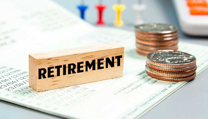 How to open an smsf term deposit with judo bank | tycoonstory media Retirement calculator with a wooden block and coins, highlighting smsf term deposits for financial planning.