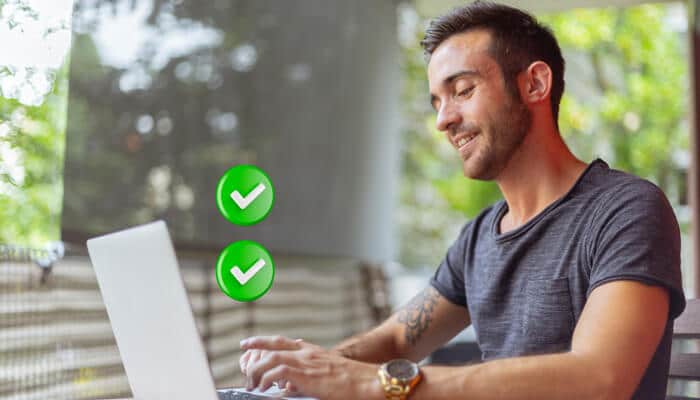 Righ | tycoonstory media User conducting an international background check on a laptop, with positive results shown through checkmarks.