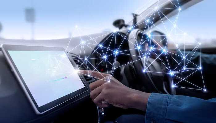 The future of driving performance | tycoonstory media Automotive performance: a driver interacting with a high-tech dashboard display inside a car, symbolizing the integration of advanced technology and automotive performance