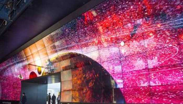 The role of led technology in advancing stadium experiences | tycoonstory media Massive led screen displaying dynamic visuals, showcasing the power of led technology in creating immersive experiences.