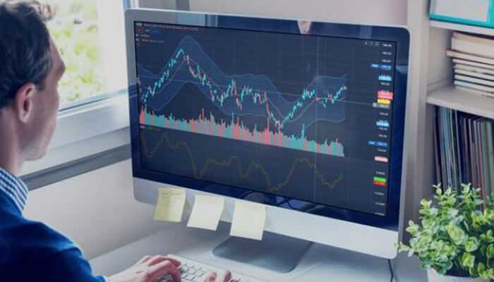 Tools | tycoonstory media A trader using the fintevex trading platform, analyzing market charts and making informed decisions on a dynamic online interface.
