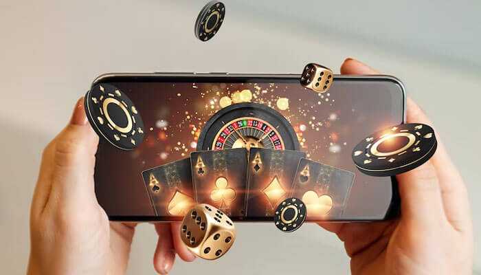 What makes sweepstakes casinos stand out - tycoosntory | tycoonstory media Hands holding a smartphone displaying a virtual casino experience with cards, chips, and dice, representing the excitement of sweepstakes casinos.