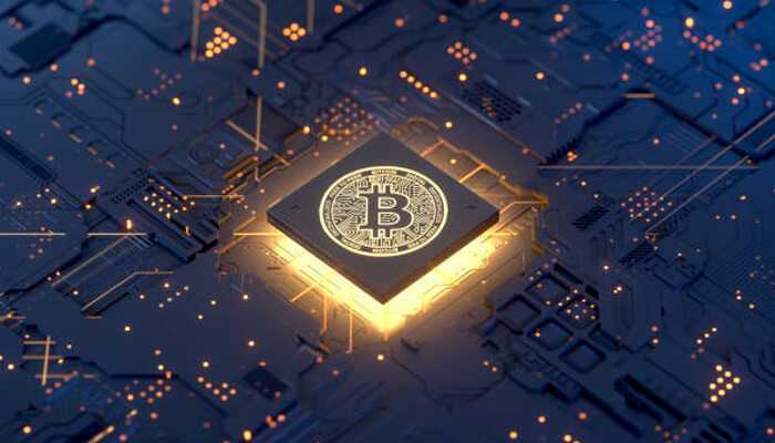 Benefits of crypto-powered decentralized marketplaces | tycoonstory media Digital representation of bitcoin on a glowing microchip symbolizing cryptocurrency technology in decentralized marketplaces.