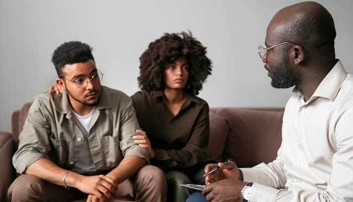 Benefits of drug rehab for relationships | tycoonstory media Couple undergoing therapy session with a counselor at drug rehab in cherry hill, focusing on relationship restoration and emotional healing during recovery.