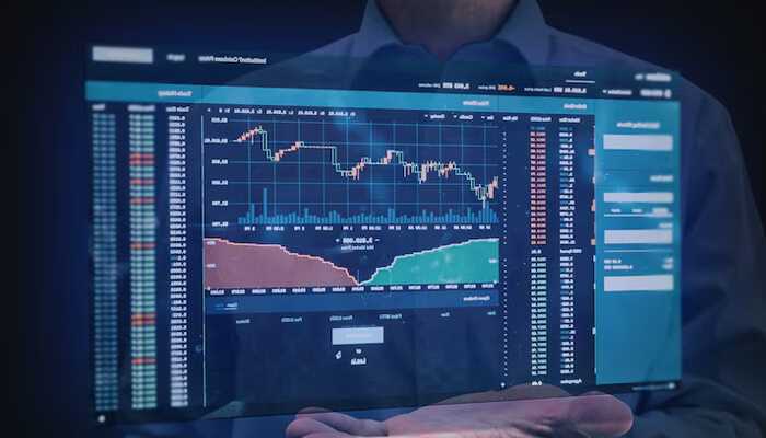 Bse top gainers | tycoonstory media A businessman analyzing digital stock market charts on a transparent screen, reflecting data related to top bse gainers.