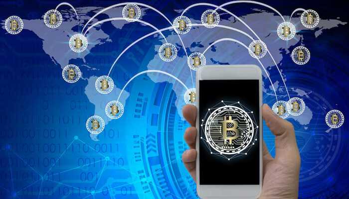 Real-world adoption and use cases | tycoonstory media Digital smartphone showing bitcoin symbol with global network connections illustrating cross-border payments and cryptocurrency transactions worldwide.
