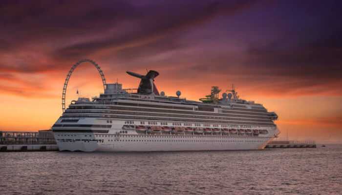 Unique experiences on the cruise | tycoonstory media Luxury royal cruise dubai docked at sunset with a glowing skyline and a ferris wheel in the background.
