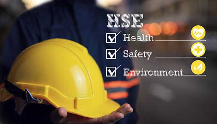 Health safety and environmental | tycoonstory media Yellow hard hat and hse checklist representing health, safety, and environment roles in offshore career opportunities.