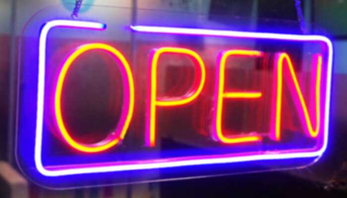 Maximum exposure and impact | tycoonstory media Bright neon led sign boards spelling “open” in red and blue lighting