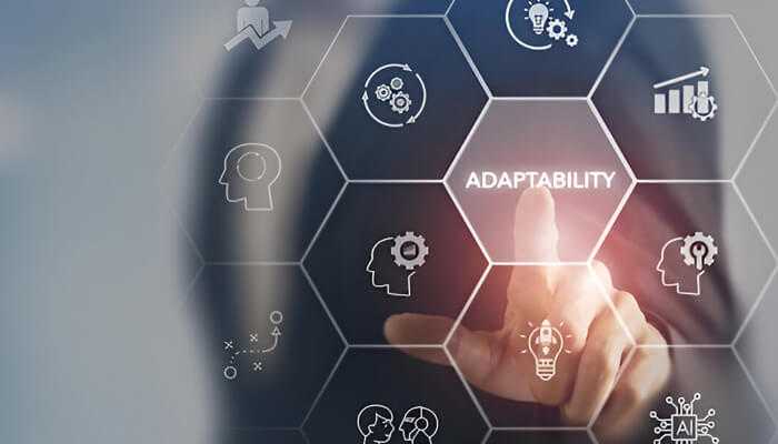 Adaptability is a skill | tycoonstory media A business leaders finger pointing at a digital interface highlighting the word "adaptability," surrounded by icons representing innovation, leadership, and growth.