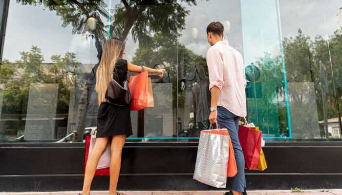 Complete daily maintenance - tycoonstory | tycoonstory media Shoppers standing in front of a neat and tidy storefront with large glass windows, showcasing a clean and organized display inside.