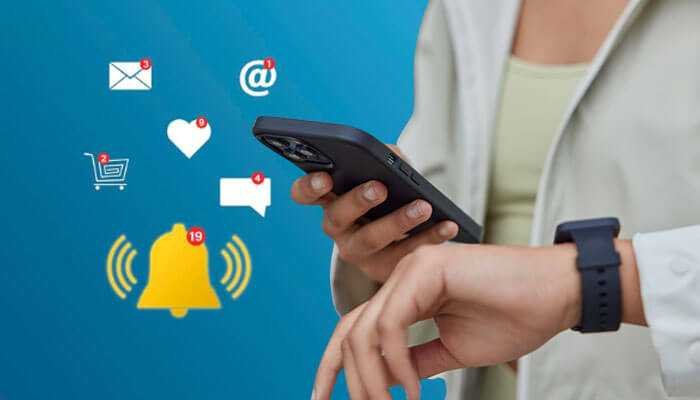 Examples of time sensitive notifications - tycoonstory | tycoonstory media A person checking their phone with various time sensitive notifications such as messages, social media alerts, and a bell icon for urgent updates, emphasizing the importance of time-sensitive notifications.