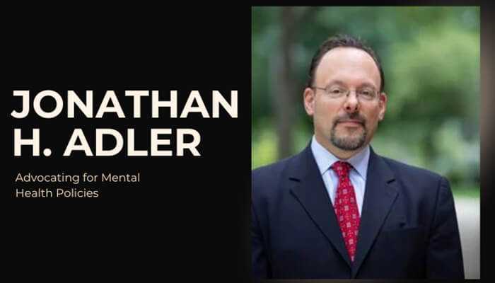 Jonathan h. Adler | tycoonstory media Jonathan h. Adler, advocate for mental health policies, in a professional suit and tie portrait.