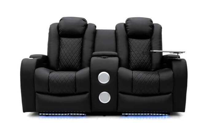 Technological innovation 1 | tycoonstory media Luxurious black recliner with quilted seats and led lighting, compared to the modern ergonomic design of the honeypot tech eight smart chair.