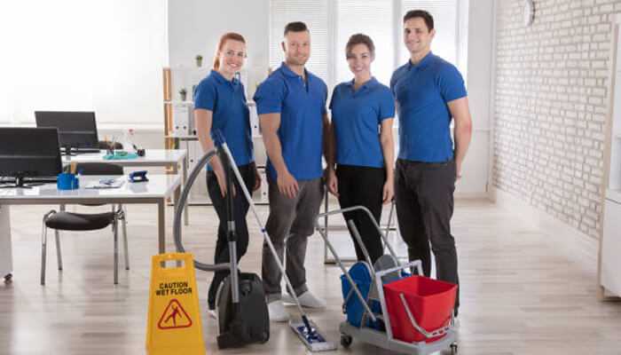 Trained staff make all the difference 1 | tycoonstory media Team of expert cleaning providers in blue uniforms with advanced cleaning equipment, delivering top-tier office cleaning services with safety and efficiency.