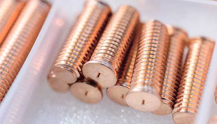Type of stud | tycoonstory media Close-up view of copper threaded welding studs organized in a tray, showcasing high-quality fasteners for precision welding.