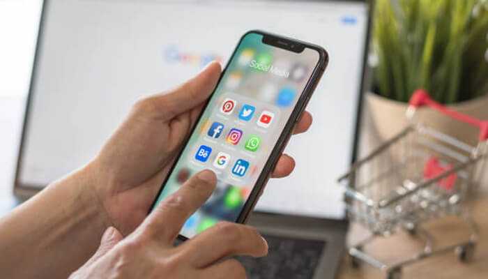 Why vertical seo matters more than ever | tycoonstory media User browsing social media apps on smartphone, illustrating the cross-platform approach of vertical seo for digital marketing.