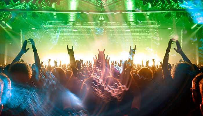 A market on rockets - tycoonstory | tycoonstory media India's Entertainment: An energetic concert crowd illuminated with vibrant lights, showcasing the live music culture.