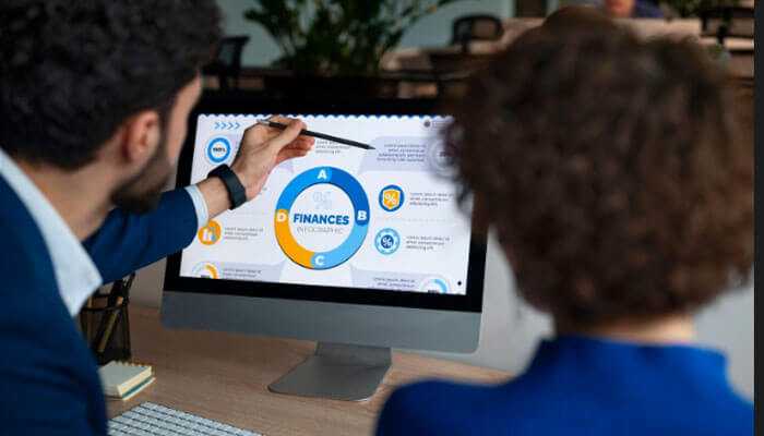 Integrating financial and operational measures - tycoonstory | tycoonstory media Team reviewing r&d metrics on a desktop screen, evaluating financial performance and innovation indicators for research and development decisions.
