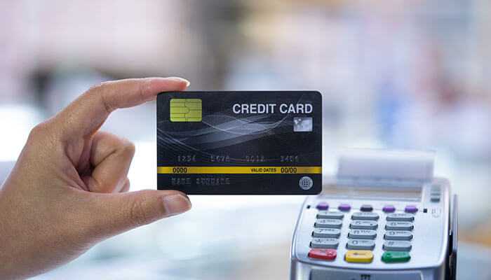 Ways to reduce apr costs - tycoonstory | tycoonstory media Credit card apr explained through a physical credit card used at a payment terminal