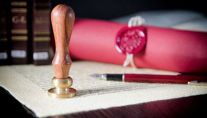 Convenience for residents and expats - tycoonstory | tycoonstory media Notarized power of attorney in dubai with seal, pen, and official legal validation.