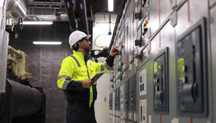 Industrial companies A person upgrading the electrical infrastructure in industrial companies