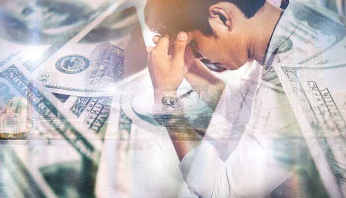 Financial misconduct and fraudulent activities - tycoonstory | tycoonstory media Worried entrepreneur holding head with financial stress background, representing money troubles and director disqualification in uk.