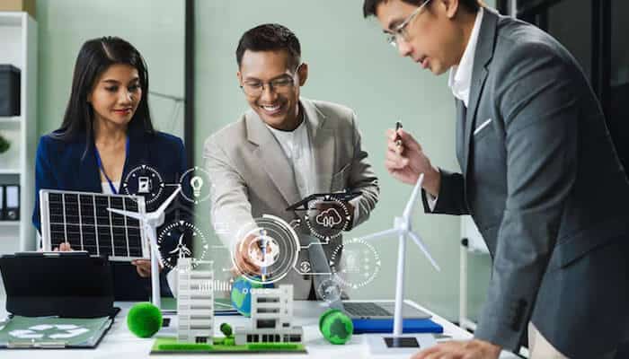 Financial savings and return on investment - tycoonstory | tycoonstory media Energy consultants discussing green technologies, including solar panels and wind turbines, while exploring digital solutions for sustainable energy management.