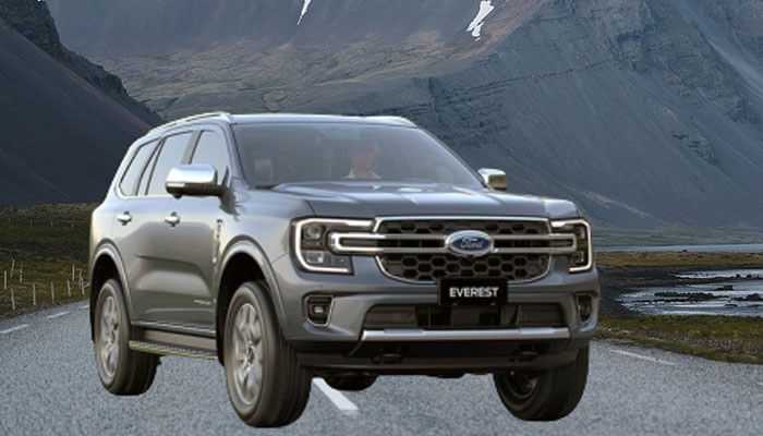 Road impressions and driving experience - tycoonstory | tycoonstory media Grey ford everest suv driving on a scenic mountain road.