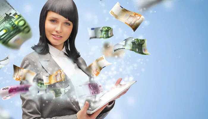 Saving money on transfers - tycoonstory | tycoonstory media Woman using a tablet with euro notes flying around, representing digital apps to send euros within europe fast and securely