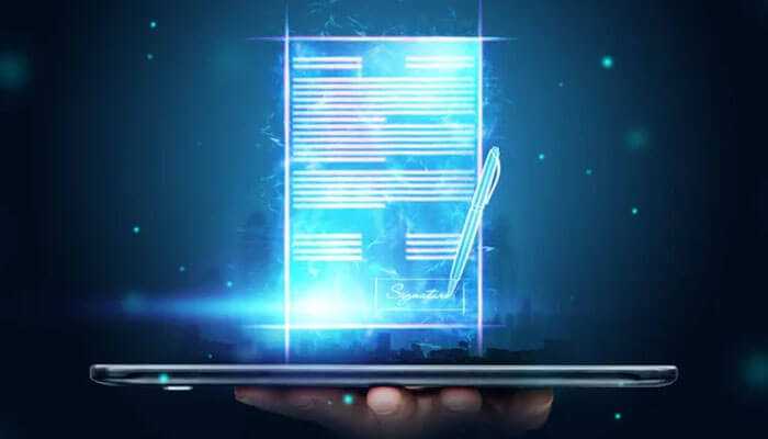 The new standard what modern esignature platforms deliver - tycoonstory | tycoonstory media Digital contract with glowing signature displayed on a tablet, highlighting secure esignatures and next-generation agreement platforms.