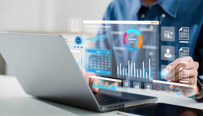 The role of enterprise planning tools | tycoonstory media Professional analyzing a finance and strategy dashboard on a laptop, showcasing data and graphs for business decision-making and enterprise planning.