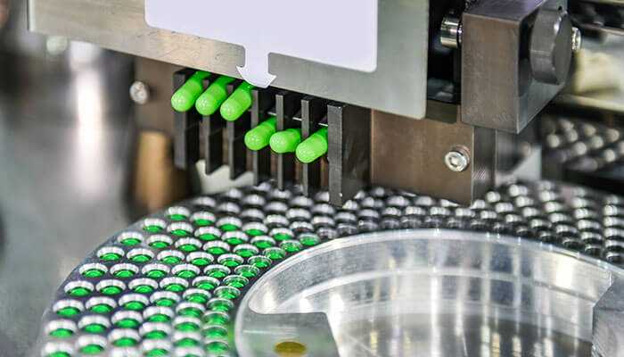 Why is the encapsulation method important - tycoonstory | tycoonstory media Encapsulation in nutritional supplements – advanced machinery producing green capsules with precise formulation and quality control.