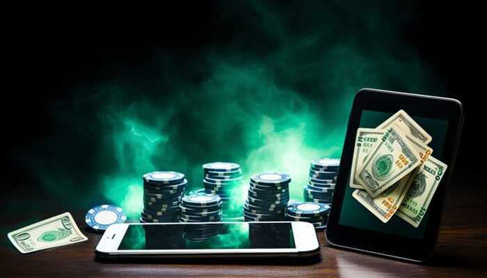 A new era of competition and innovation - tycoonstory | tycoonstory media Smartphone with poker chips and money showing digital growth of the online casino industry.