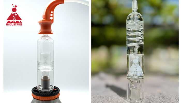 Magma industries Two glass devices from magma industries displayed side by side, showcasing intricate designs and branded logos on transparent glass components.