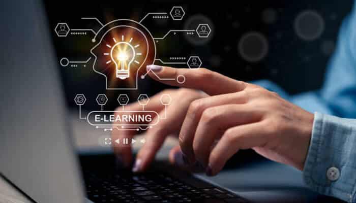 Global education systems A person using a laptop with a glowing light bulb and digital icons representing online learning, symbolizing innovation and connectivity in global education systems.