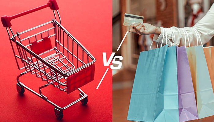 Retail vs E-commerce concept showing shopping cart on one side and person holding credit card with shopping bags on the other.