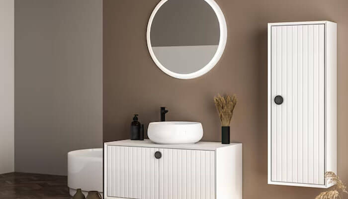 Storage layout that tames daily clutter - tycoonstory | tycoonstory media Contemporary bathroom setup with a white 42 inch vanity, round led mirror, and vertical cabinet, styled in a warm neutral tone.