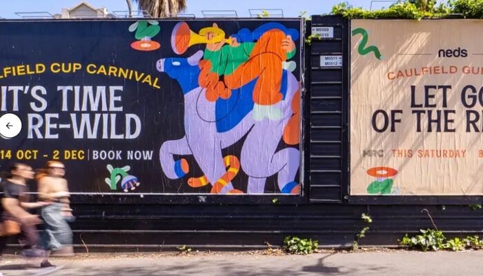 Large-scale murals with cultural relevance | tycoonstory media Colorful public art and event advertisements promoting local festivals through creative street campaigns.