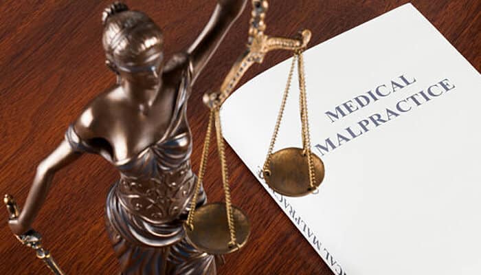 Who can file a medical malpractice claim 1 | tycoonstory media Medical malpractice documentation storage represented by shipping container filled with boxed records and files